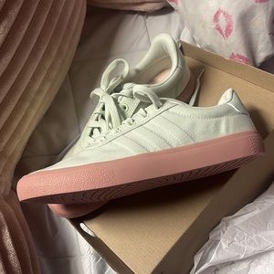 Green Adidas new end plastic waste sneakers .